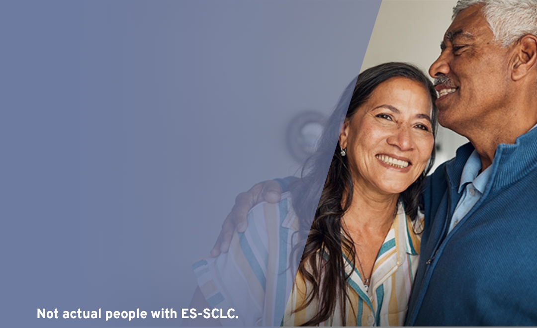 older couple smiling and hugging, representing support and care during IMDELLTRA® treatment