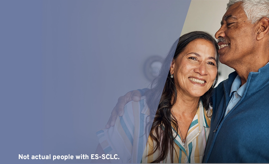 older couple smiling and hugging, representing support and care during IMDELLTRA® treatment