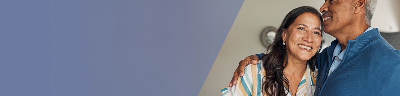 older couple smiling and hugging, representing support and care during IMDELLTRA® treatment